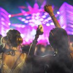 People at concert with smoke overlay texture